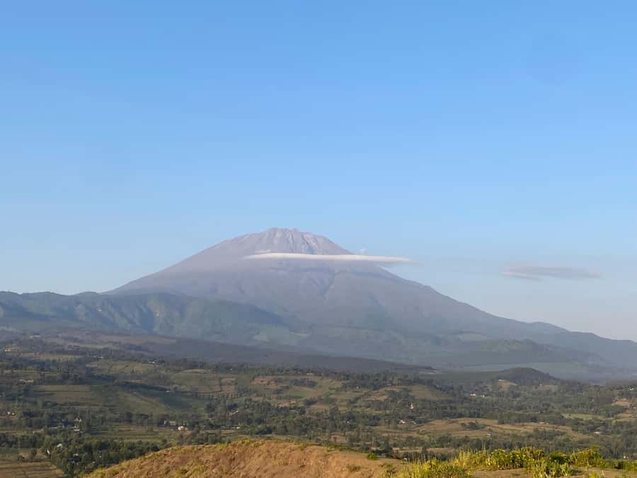 Arusha: Golden Hour Walk & Sunset Viewpoint Over Mount Meru - Reaching the hilltop crater