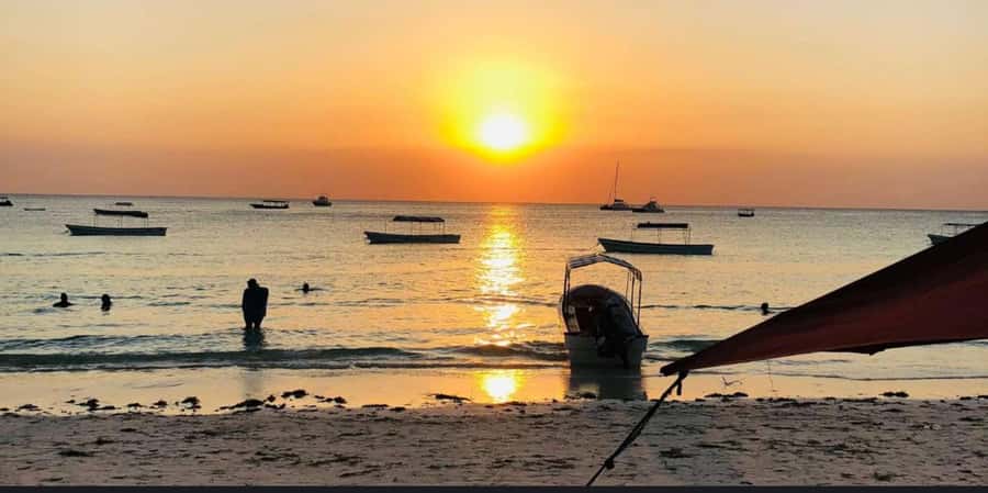 FROM NUNGWI; SUNSET DHOW CRUISE EXPERIENCE - Setting out from Nungwi Beach at sunset