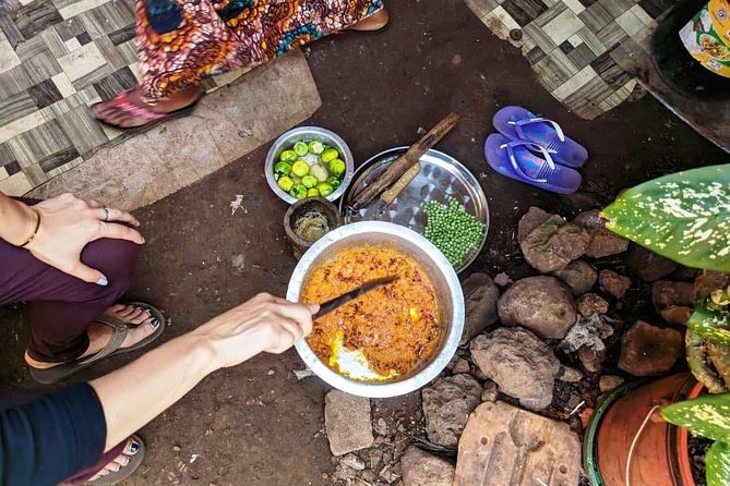 Private Market Tour and Tanzanian Cooking Class in Moshi - Grating coconut with a traditional buzi