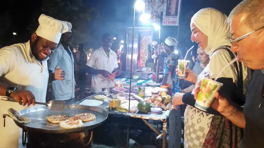 Stonetown: Food Markets and Street Food Walking Tour - Walking through Stone Town after dark
