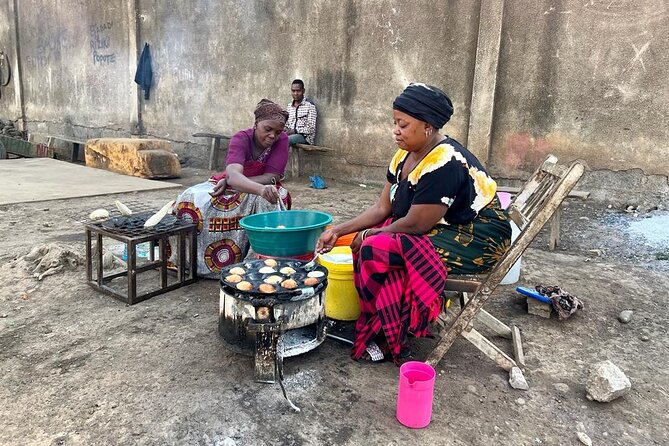 Street Food and Community Walking Tour - Maize milling and carpentry in everyday use