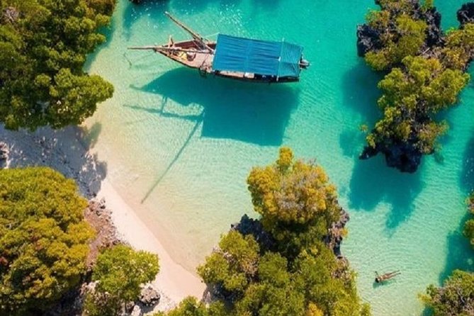 Zanzibar Dhow Cruise day adventure, sea sports at Kwale Island, very memorable - The sandbank stop, swimming, and fresh fruit