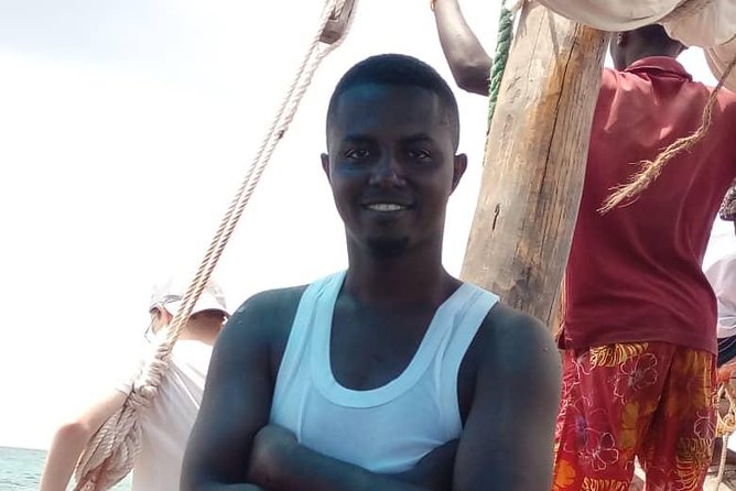 Zanzibar Dhow Cruise day adventure, sea sports at Kwale Island, very memorable - Snorkeling over Zanzibar’s coral reefs