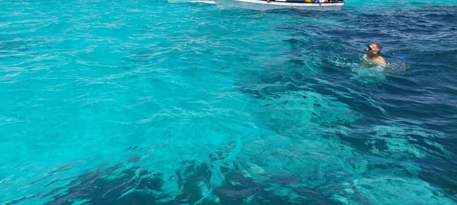 Zanzibar: Mnemba Island Dolphin and Snorkeling Tour - The sandbank, fruit, and possible lunch